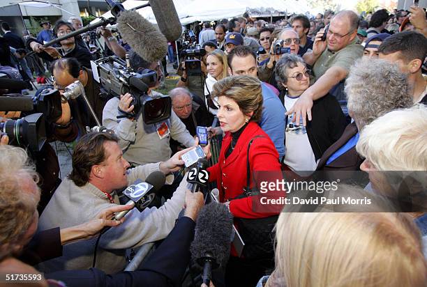 Gloria Allred, attorney for Amber Frey, speaks to the media as she leaves the courthouse after Scott Peterson was convicted of murder November 12,...