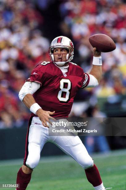 Quarterback Steve Young of the San Francisco 49ers sights his target and releases in a 27 to 19 win over the Carolina Panthers on . (ArtSelect on .