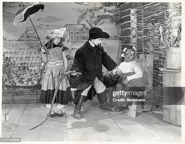 Movie Still from "Our Gang". MGM Hal Roach Comedy. L-R: Dorothy DeBorba, Kendall McComas, Matthew “Stymie” Beard. Circa 1930.