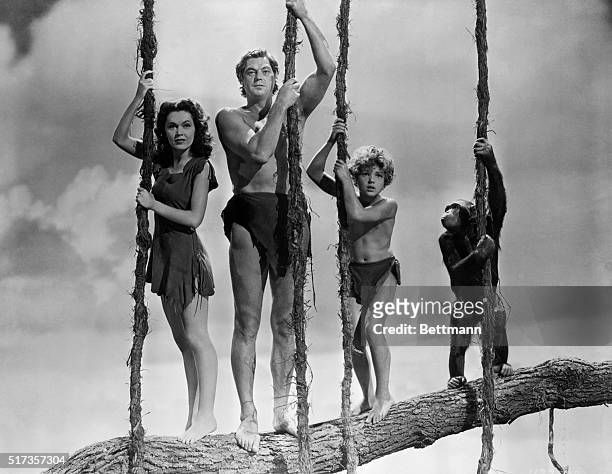 Maureen O'Sullivan as Jane, Johnny Weissmuller as Tarzan, and Johnny Sheffield as Boy, in one of three Tarzan movies they made together from 1939 to...