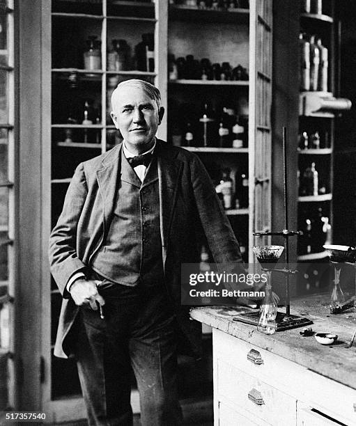 Portrait of Thomas Edison in his lab, 1904. Edison is shown here standing with a cigar in his left hand.