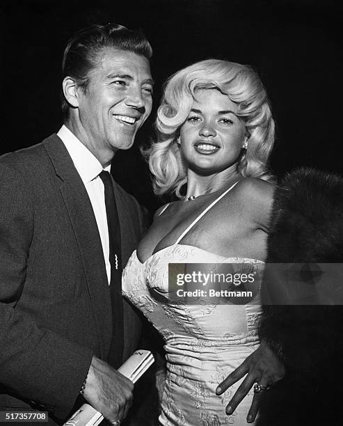 Jayne Mansfield's fans got a chance recently to compare their favorite with blonde and dark hair. The popular fad of changing one's hair color at the...