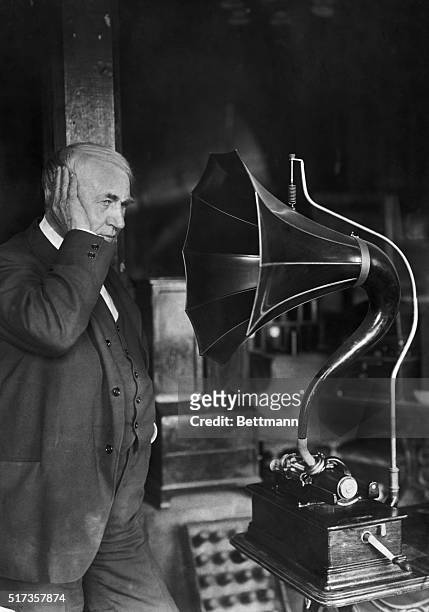 West Orange, NJ: Portrait of American inventor Thomas A. Edison , listening to a phonograph.