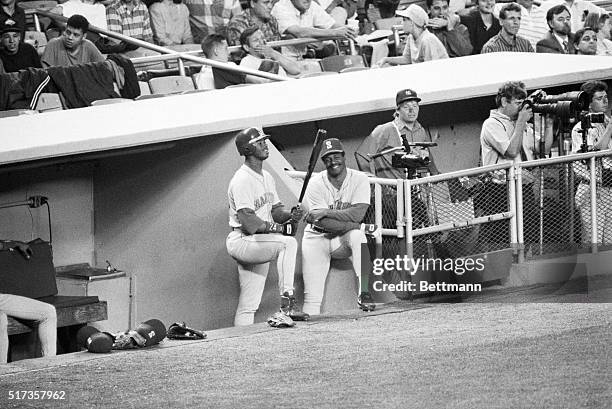 New York, NY - A very happy father and son Ken Griffey Sr. And Ken Griffey Jr. Standing at the end of the Mariners dugout and waiting their turn to...