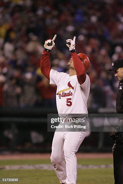 Albert Pujols of the St. Louis Cardinals celebrates after hitting a home run in the eighth inning during game two of the NLCS against the Houston...