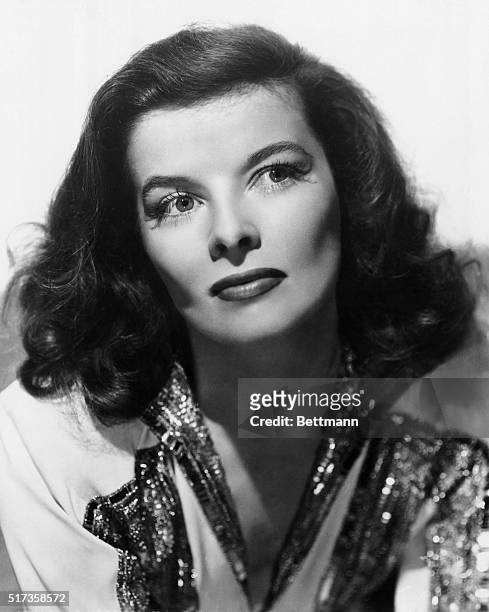 Portrait of MGM film actor Katharine Hepburn, wearing a sequined dress. Undated publicity photo.