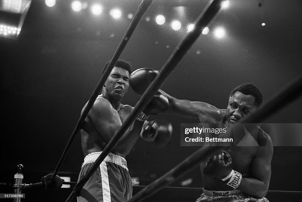 Joe Frazier Punches Muhammad Ali