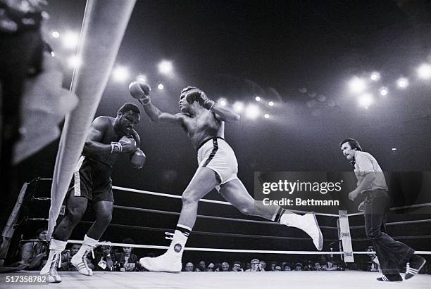 Heavyweight champion Muhammad Ali lunges at challenger Joe Frazier during the 10th round of the 'Thrilla in Manila' bout for the heavyweight...