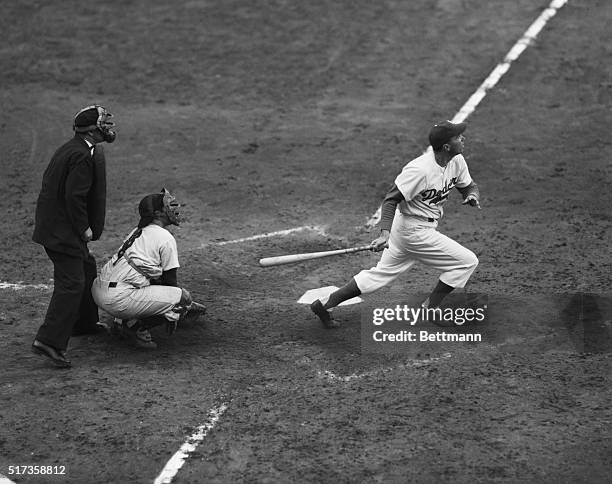 New York, NY- All eyes are raised towards the sky as umpire,catcher and batter watch the flight of Duke Snider's second home run of the sixth game of...