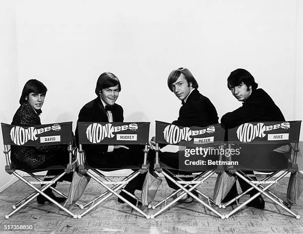 In four director chairs are seated members of the infamous group,The Monkees. David Jones, Mickey Dolenz, Peter Tork and Michael Nesmith. They are...