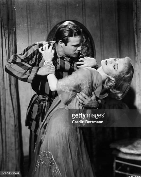 Publicity handout of a movie still for the Warner Brothers picture "A Streetcar Named Desire." In the scene, Marlon Brando clutches passionately at a...