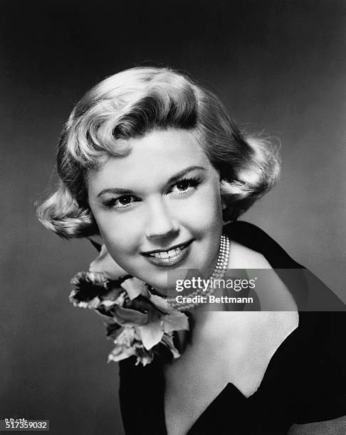 Doris Day, born 1924, blonde American Hollywood star of the 1950's. Ca. 1940s, head and shoulders photo.