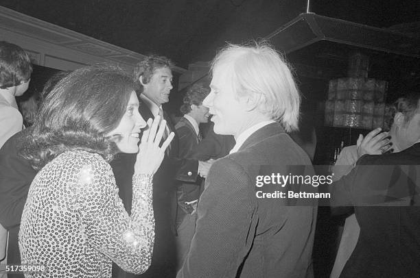 New York, New York- Margaret Trudeau, estranged wife of the Canadian Prime Minister, covers her mouth with her hand as she confides in artist Andy...