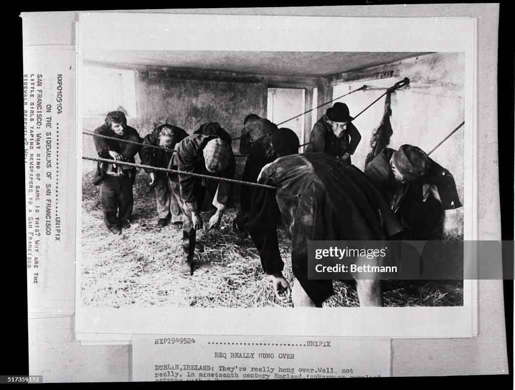 Actors "Sleeping" Draped Over Ropes