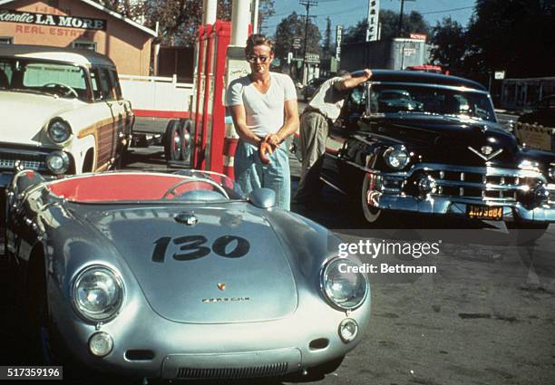 James Dean at a gas station with his silver Porsche 550 Spyder he named Little Bastard, just hours before his fatal crash.