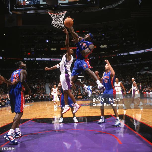 Ben Wallace of the Detroit Pistons rebounds against the Toronto Raptors during the game at the Air Canda Center on November 5, 2004 in Toronto,...