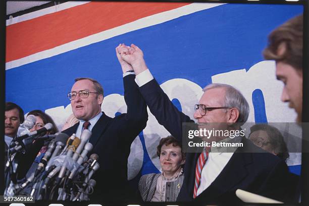 Springfield, Ill.: Governor James Thompson and his running mate Lt. Gov. George Ryan hold up hands in jubilation after official vote count.