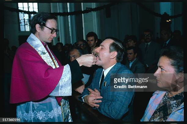 Lech Walesa, Celebrating Name Day 6/3/83. Lech Walesa Receiving Communion.