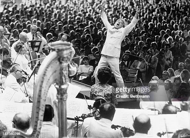 Conductor Leonard Bernstein at the climax of Mahler's Resurrection symphony performed by the Boston Symphony in Lenox, Massachusetts, 8th July 1970.