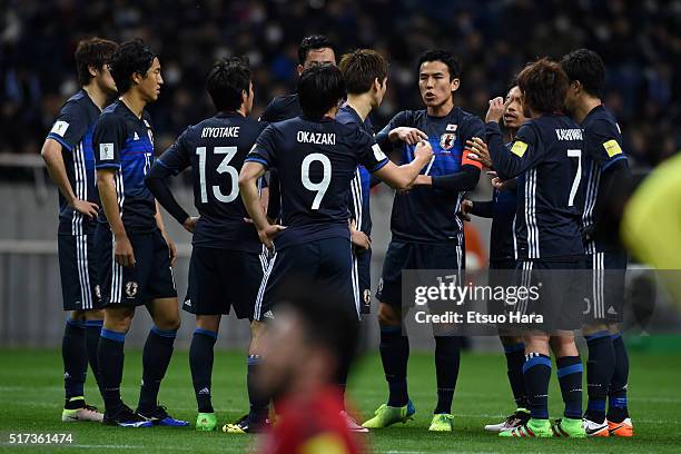 Captain Makoto Hasebe of Japan#17 discusses strategy with his team mates during the FIFA World Cup Russia Asian Qualifier second round match between...