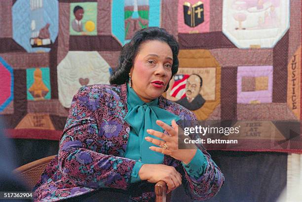Atlanta. With a quilted portrait of her late husband Martin Luther King Jr. Looking over her shoulder, Coretta Scott King explains the philosphy of...