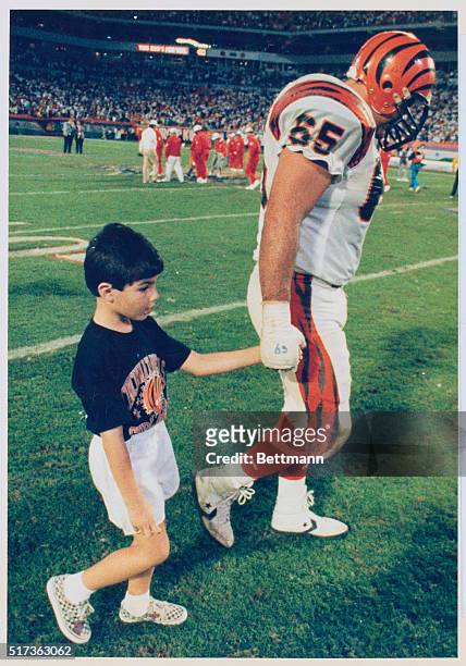 Miami, Florida: A dejected father and son, Max Montoya and Matthew, dejectedly leave the field at Joe Robbie stadium 1/22, after Montoya and the...