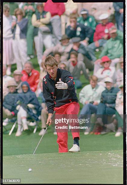 Augusta, Ga.: Nick Faldo tries to urge in his trap shot on the 2nd hole during the 2nd round of the Masters but had to settle for par. Faldo made the...
