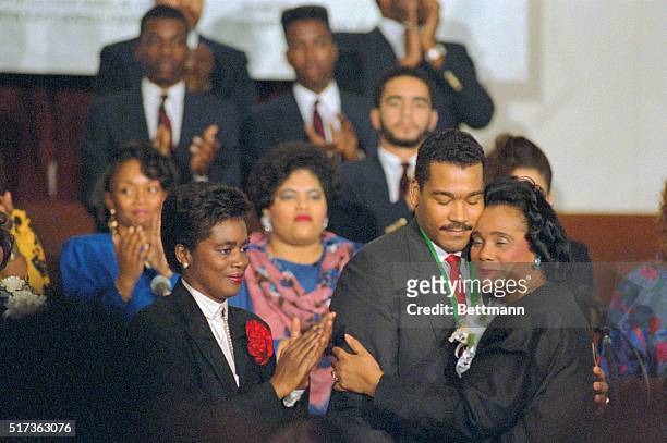 Atlanta. Coretta Scott King hugs her youngest son, Dexter, after passing the "torch" of the presidency of the Martin Luther King Jr. Center for...
