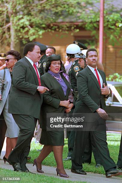 Civil rights leader Coretta Scott King is escorted by her sons, Dexter and Martin Luther King III, into the west hunter street Baptist Church for...