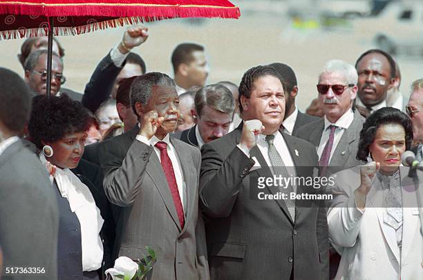 Atlanta Mayor Maynard Jackson and Coretta Scott King, widow of slain civil rights leader Dr. Martin Luther King, Jr., join Nelson Mandela in holding...