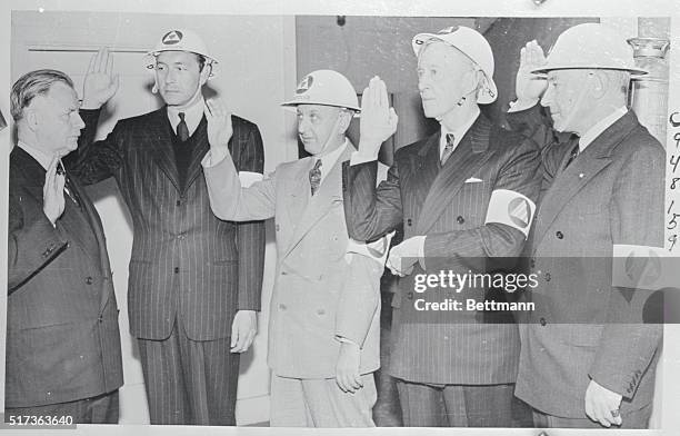 Four bright lights of the movie world are shown here being sworn into defense posts in Hollywood's Civilian Defense Army by Federal Judge J.F.T....