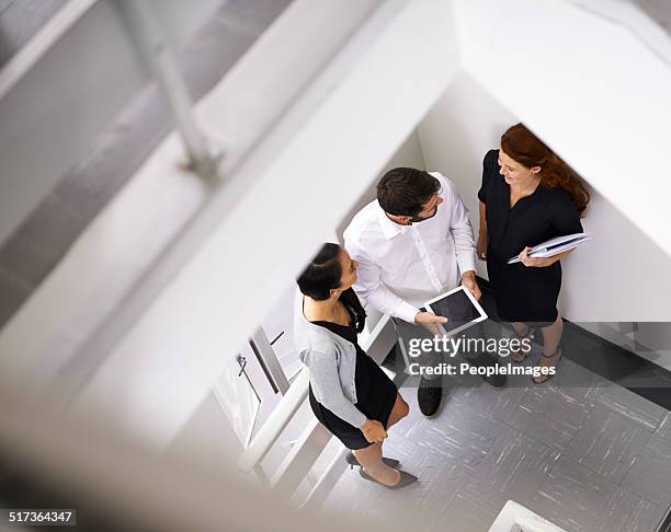 quick brainstorm on the way to their meeting - peopleimages stock pictures, royalty-free photos & images