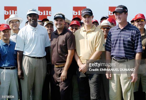 Golf world number one Fiji's Vijay Singh and pro golfers Sweden's Daniel Chopra , England's Justin Rose and US Todd Hamilton pose for a group photo...