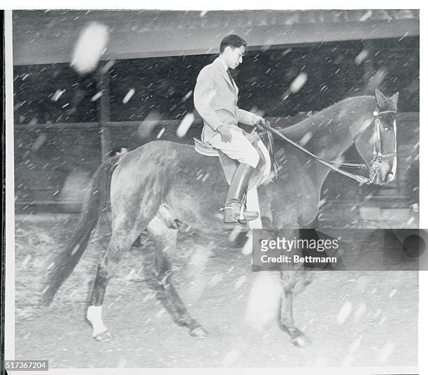 Royal Rider.Tokyo: Crown Prince Akihito of Japan doesn't let a surprise snowfall interfere with a horseback ride around the inner court of the...