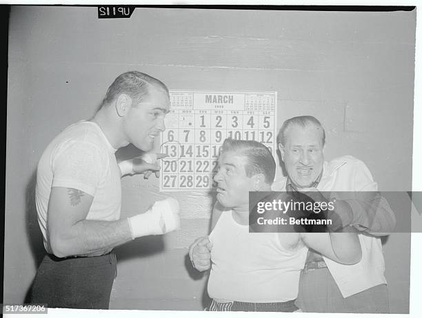 Fight of the Century. Hollywood, California: Pudgy comedian Lou Costello is restrained by his partner Bud Abbott as he tries to get at middleweight...