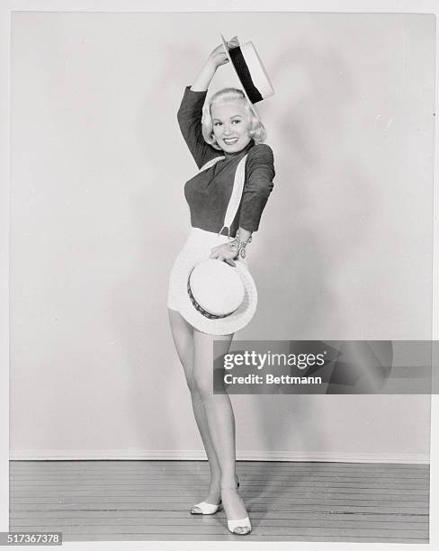 One fashion note that sould draw a lot of male attention is emphasized by film star Mamie Van Doren. She offers a reminder that May 15th is "Straw...