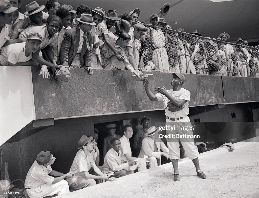 Jackie Robinson Signing Autographs from Field