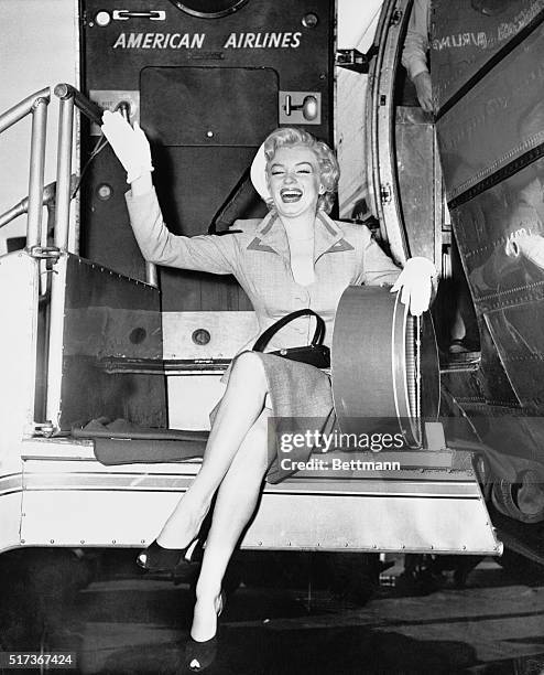 Film actress Marilyn Monroe says "Hello" to New York after arriving at LaGuardia Airport from Hollywood. Her brief stay in New York will be devoted...