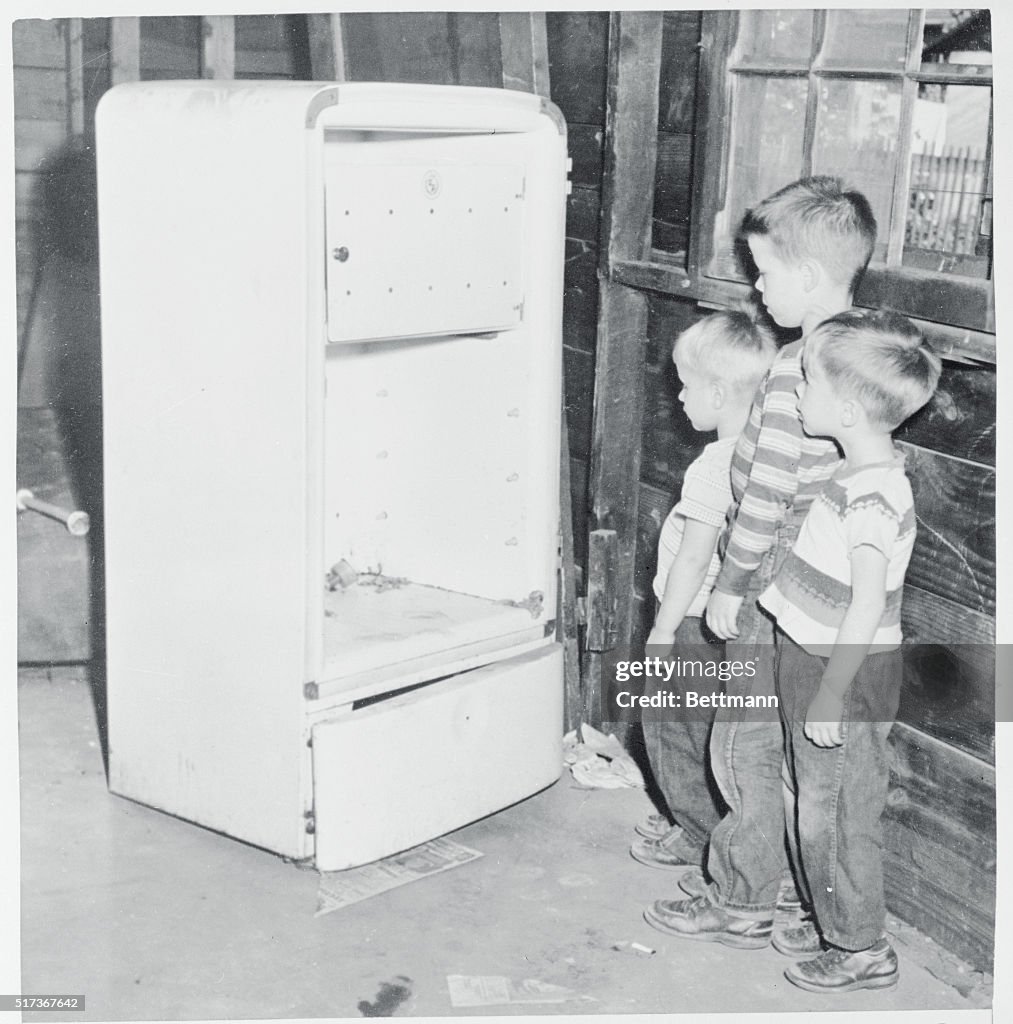 Children Looking at an Icebox