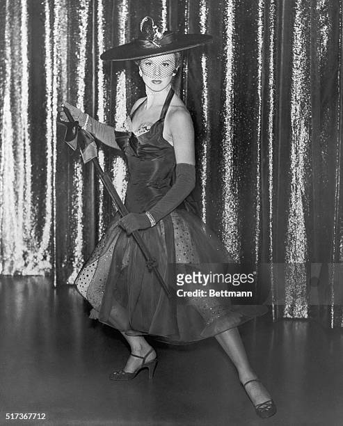 Singing star, Doris Day models the outfit designed by Leah Rhodes which is part of her wardrobe for her forthcoming film April in Paris. Shocking...