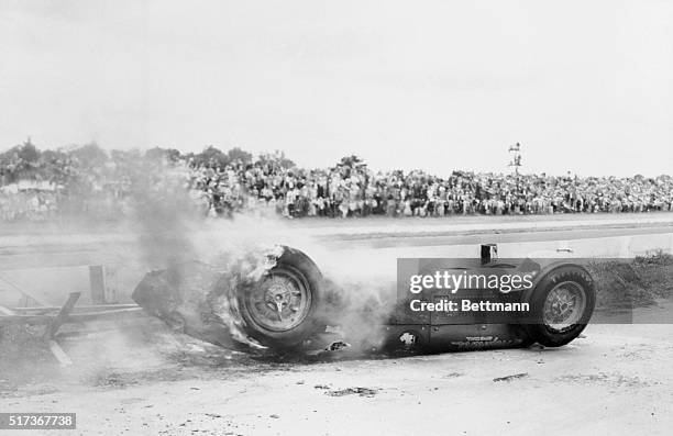 Indianapolis: Death Claims a Driver. The badly-burned Hopkins Special in which ace driver Bill Vukovich was burned to death, smolders at Indianapolis...