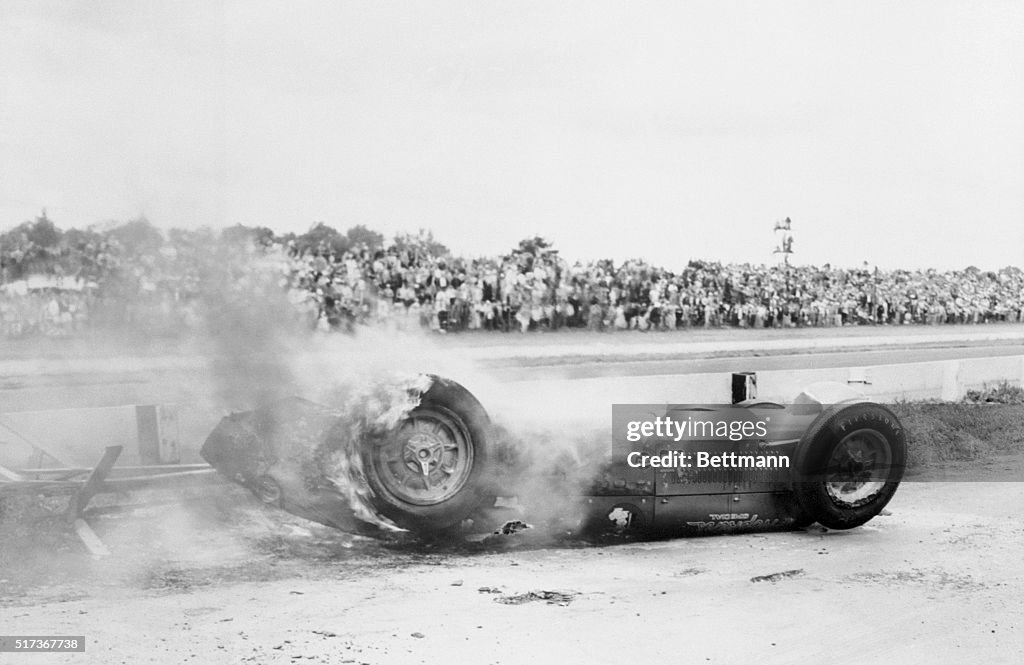 Overturned and Smoking Race Car