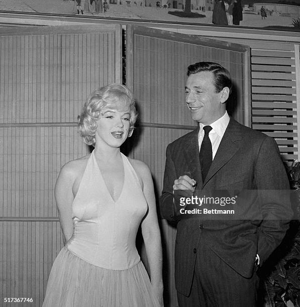 Actress Marilyn Monroe bubbles with glamor during a cocktail party here Jan. 15th for her new picture "Let's Make Love".