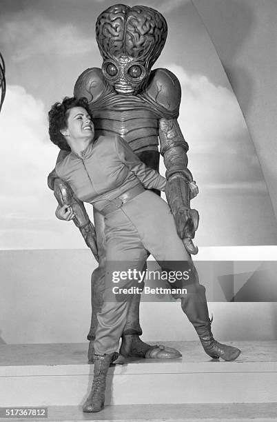 Latest thing in movie monsters...Film star Faith Domergue is menaced by a "Mutant," Hollywood-created monster. The Mutant makes its bow as a...