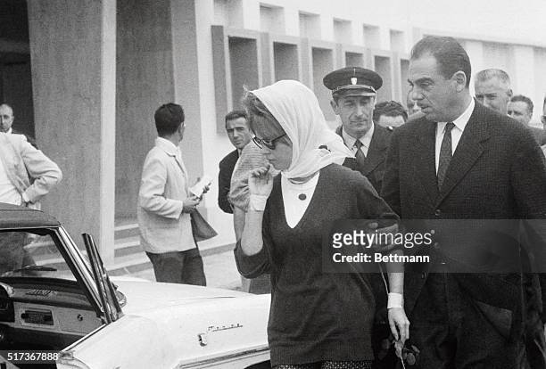 Both her wrists heavily bandaged, French actress Brigitte Bardot is escorted from the Saint Francois clinic. Miss Bardot has been confined at the...