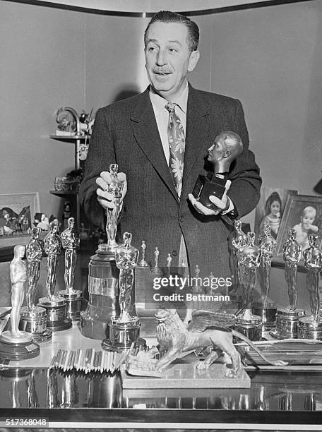 Walt Disney picked up four "Oscars" Thursday night to add to the 14 he already had for his work in cartoons in past years. He also has other numerous...