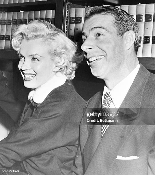 Marilyn Monroe and Joe DiMaggio in the judges' chambers just after a San Francisco judge married them.