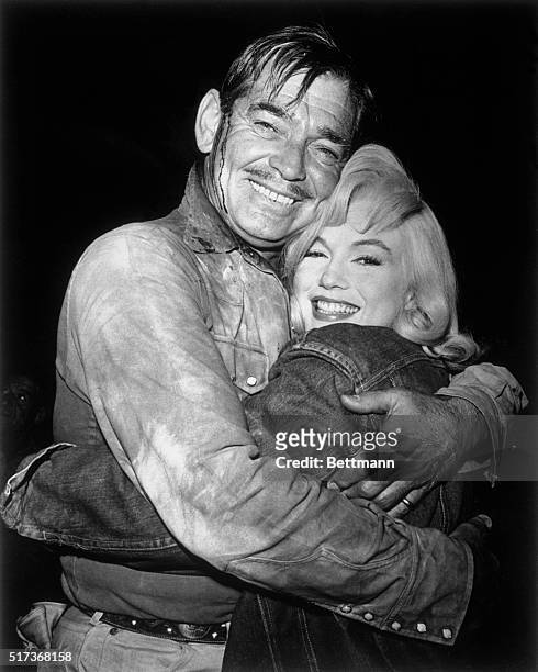 Marilyn Monroe and Clark Gable bid goodbye to each other as they completed filming of United Artists' The Misfits written by Marilyn's husband,...