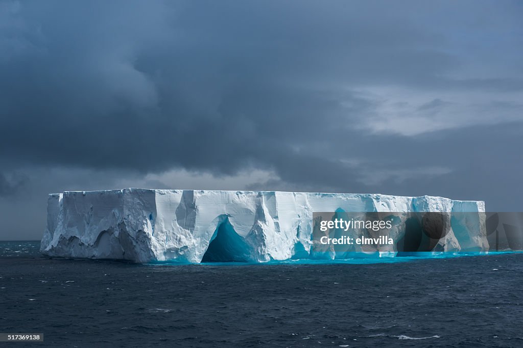 Large tabular iceberg floating in Antarctica