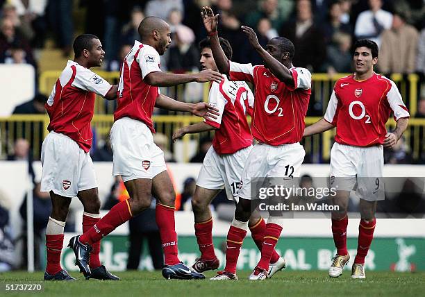 Thierry Henry of Arsenal celebates his goal with Lauren and team mates during the Barclays Premiership match between Tottenham Hotspur and Arsenal at...